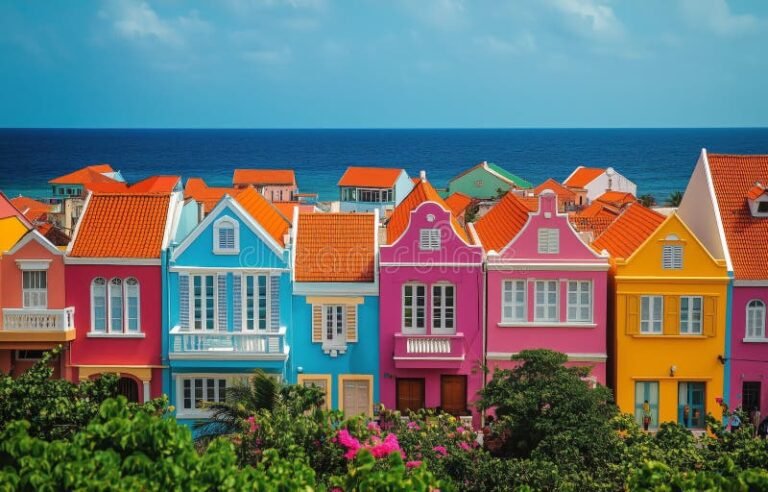 calle costera con casas coloridas y mar